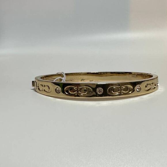 Coach Gold tone Kissing C Hinged Bangle Bracelet - Picture 6 of 9